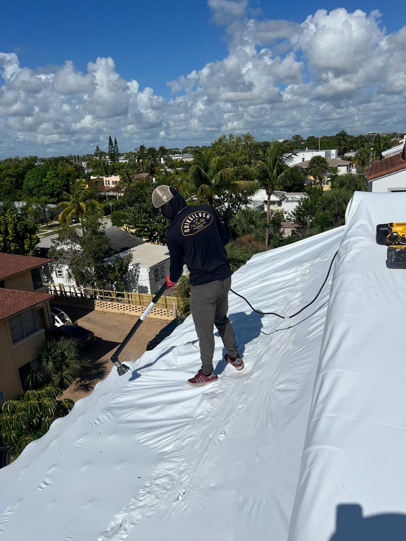 Sealing the white membrane along the roof edge